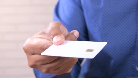 person holding a white card