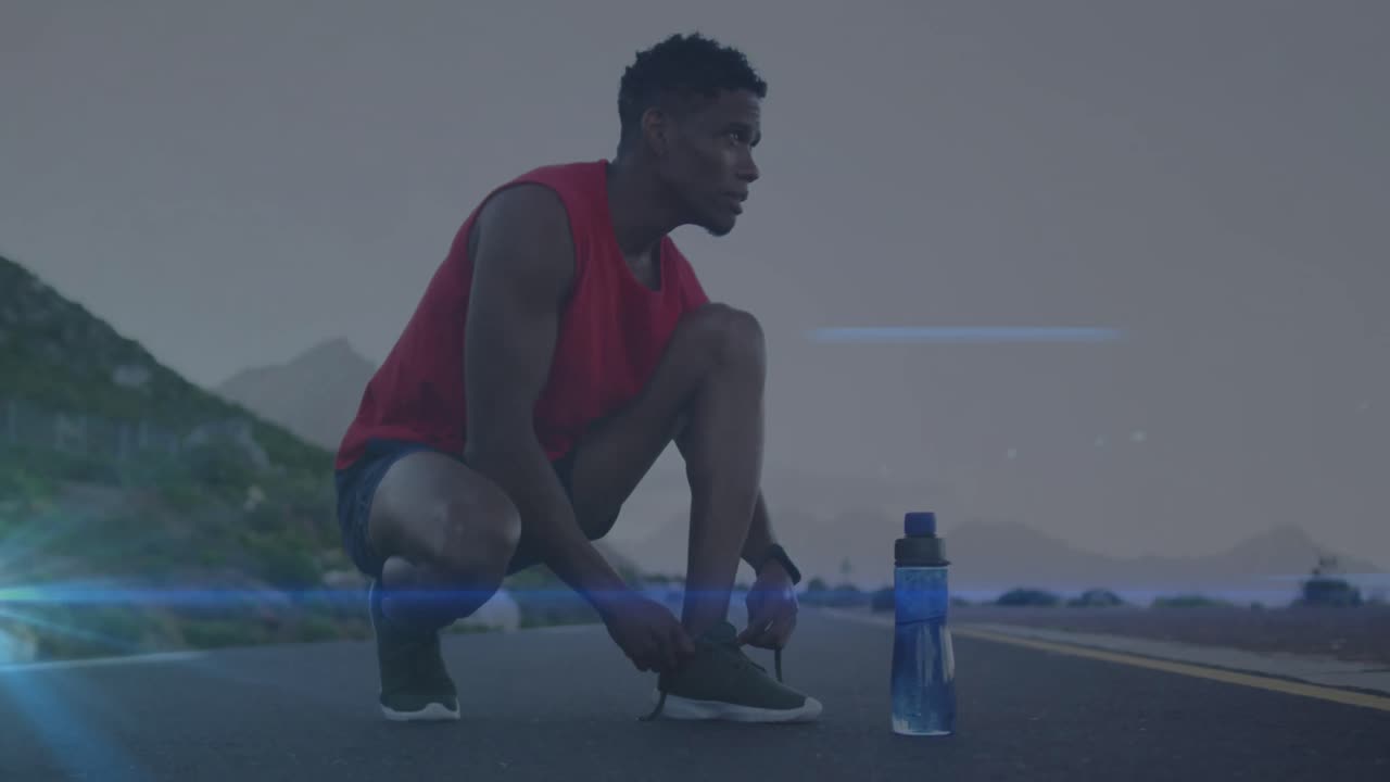 아프리카계 미국인 피트 남자가 도로에서 신발 ⁇ 을  ⁇ 는 것에 대한 파란색 빛의 애니메이션