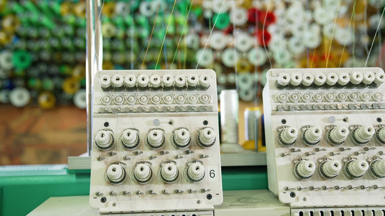 Modern sewing machine full of threads. Awesome factory sewing machine.