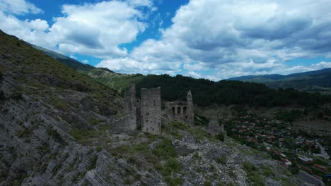 stone tower ruins cliffside vjosa peaceful kelcyre town beneath rocky fortress overlooking river valley