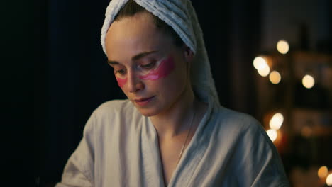 Focused-woman-typing-computer-closeup.-Business-girl-with-towel-browsing-on-pc