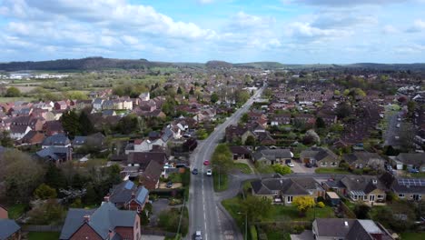 Drone-shot-flying-over-Warminster-town-in-Wiltshire,-England-on-sunny-day