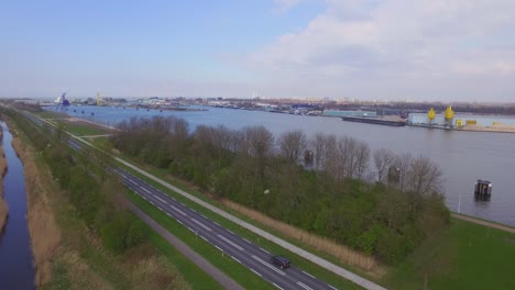 cargo ships at the port of terneuzen, netherlands, going to ghent in belgium