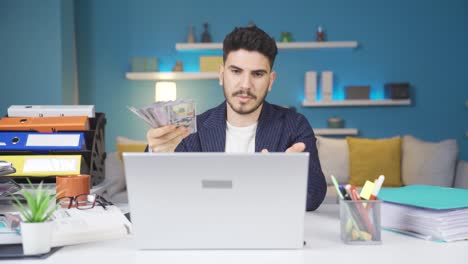 man with money in hand making video call.