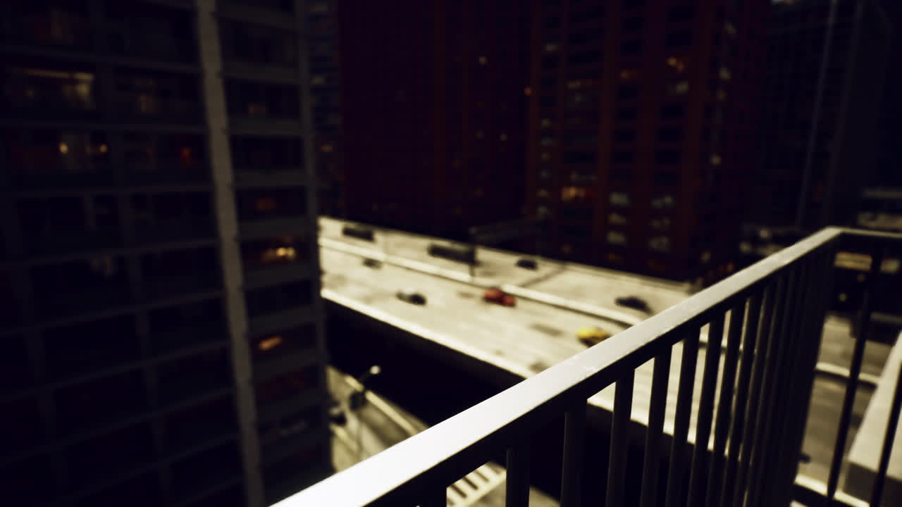 Night view from balcony overlooking bustling city street below