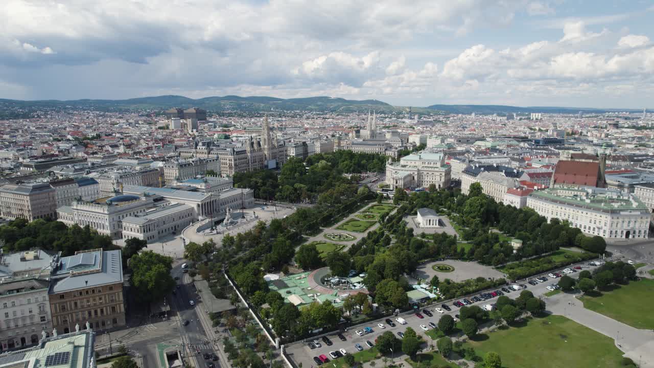 Vienna's heldenplatz and surrounding landmarks on a bright, cloudy day, aerial view