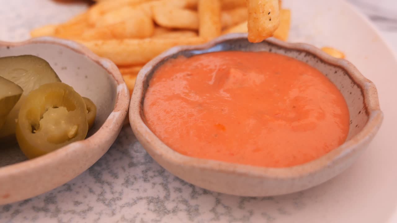 French fries with dip and pickles