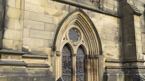 Close-up-of-old-church-entrance-in-small-English-town