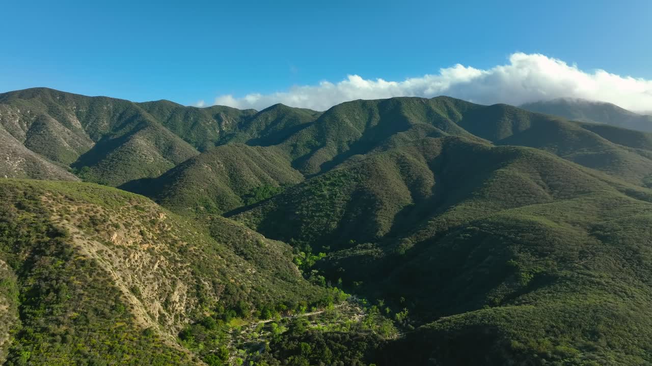 Palomar Mountain in the Peninsular Ranges in northern San Diego County, California at daytime in summer - forward aerial view