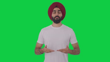 Hombre-Indio-Sikh-Haciendo-Yoga-Pantalla-Verde