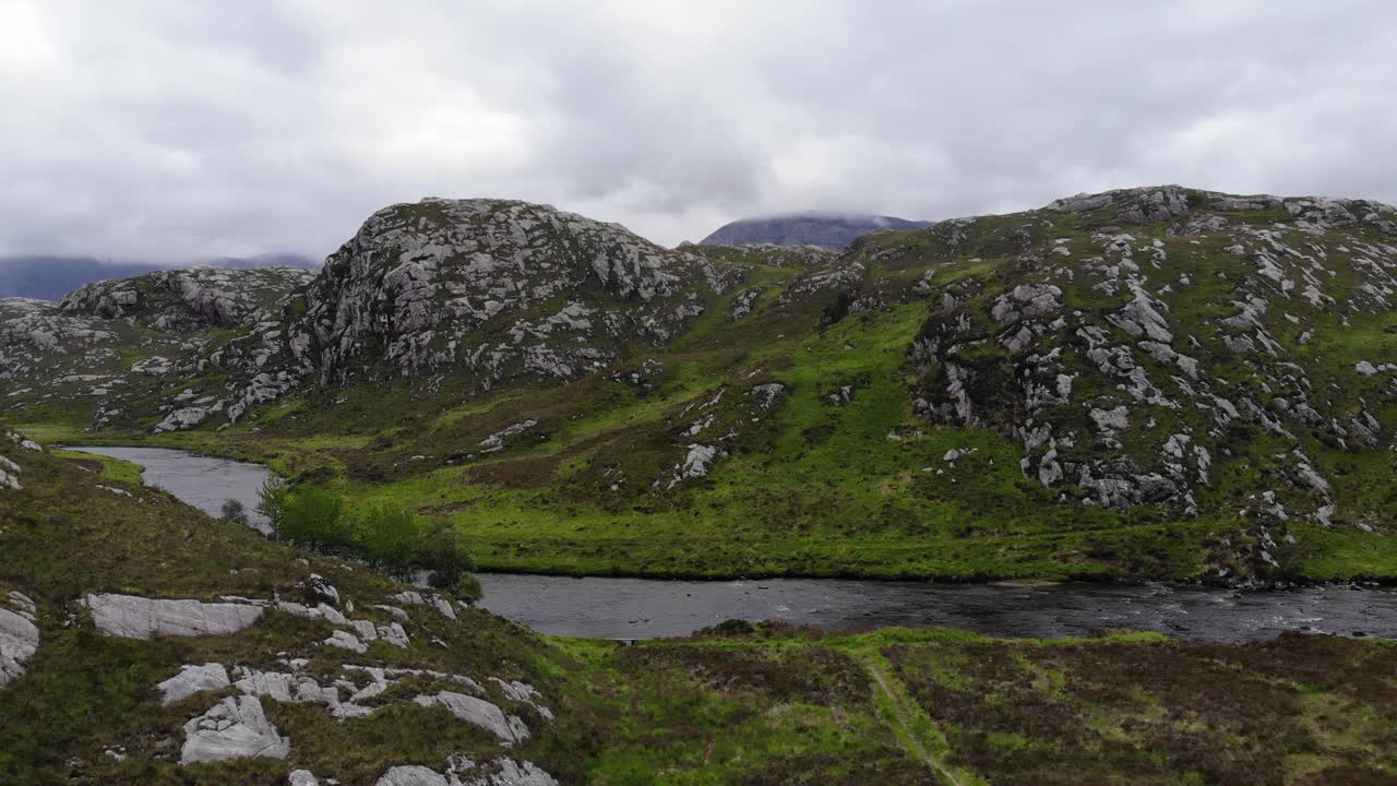 Drone footage ascending to height at River Laxford, Laxford Bridge, Lairg on the A838. Scottish Highlands in June 2019