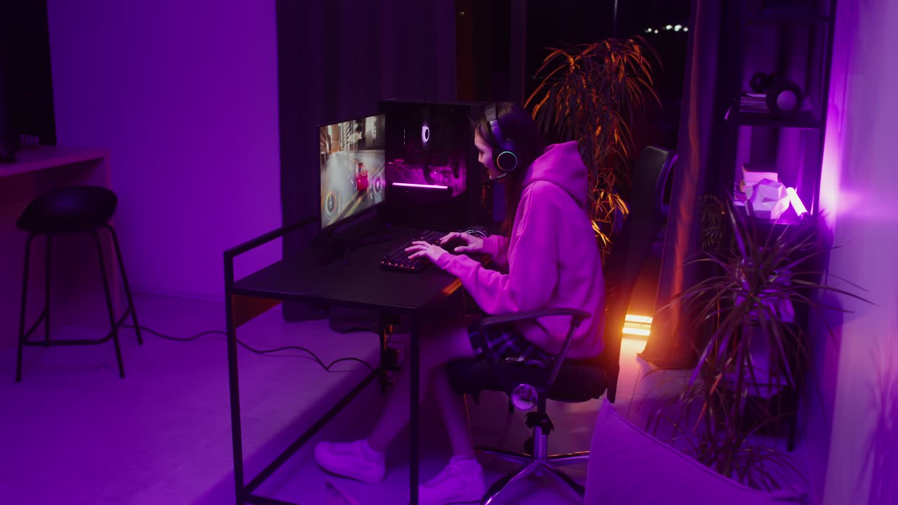Woman playing video game in her room