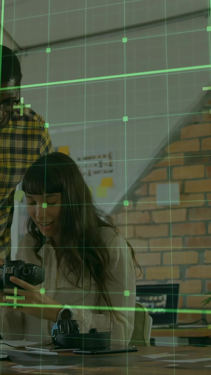 Vertical video: Woman tuning DSLR gear man guiding green grid showing photography settings