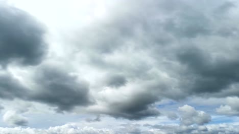 white and grey fluffy clouds rolling against clear vibrant blue sky at bright sunny day. tranquil nature cloudscape timelapse.  autumn sky.