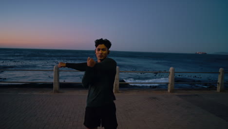 Fitness,-stretching-and-runner-at-beach