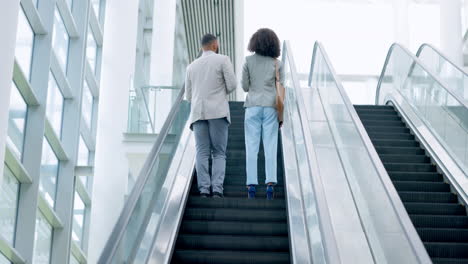 business, employees and backs on escalator at work