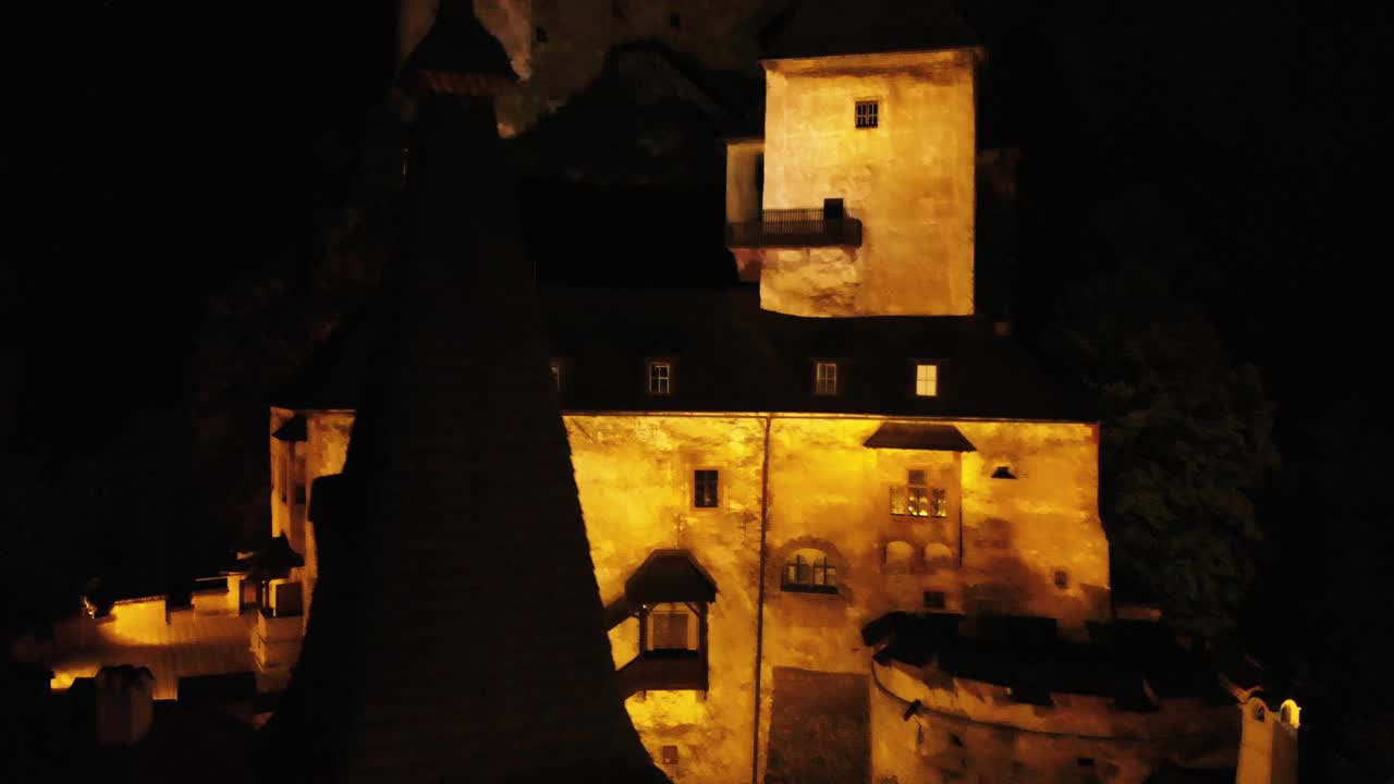 Aerial tele shot over historic Orava Castle in Slovakia at dark night - Beautiful Castles