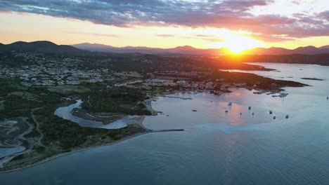 Mountain-Sunset-at-Loiri-Porto-San-Paolo-in-Sardinia,-Italy---Aerial-4k