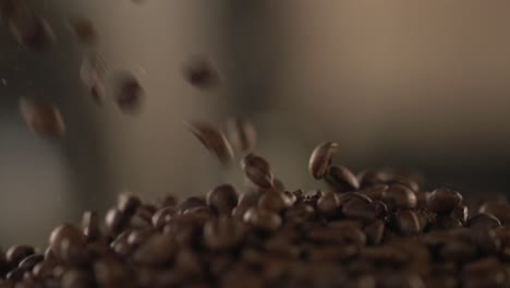 coffee beans tumble down into a pile