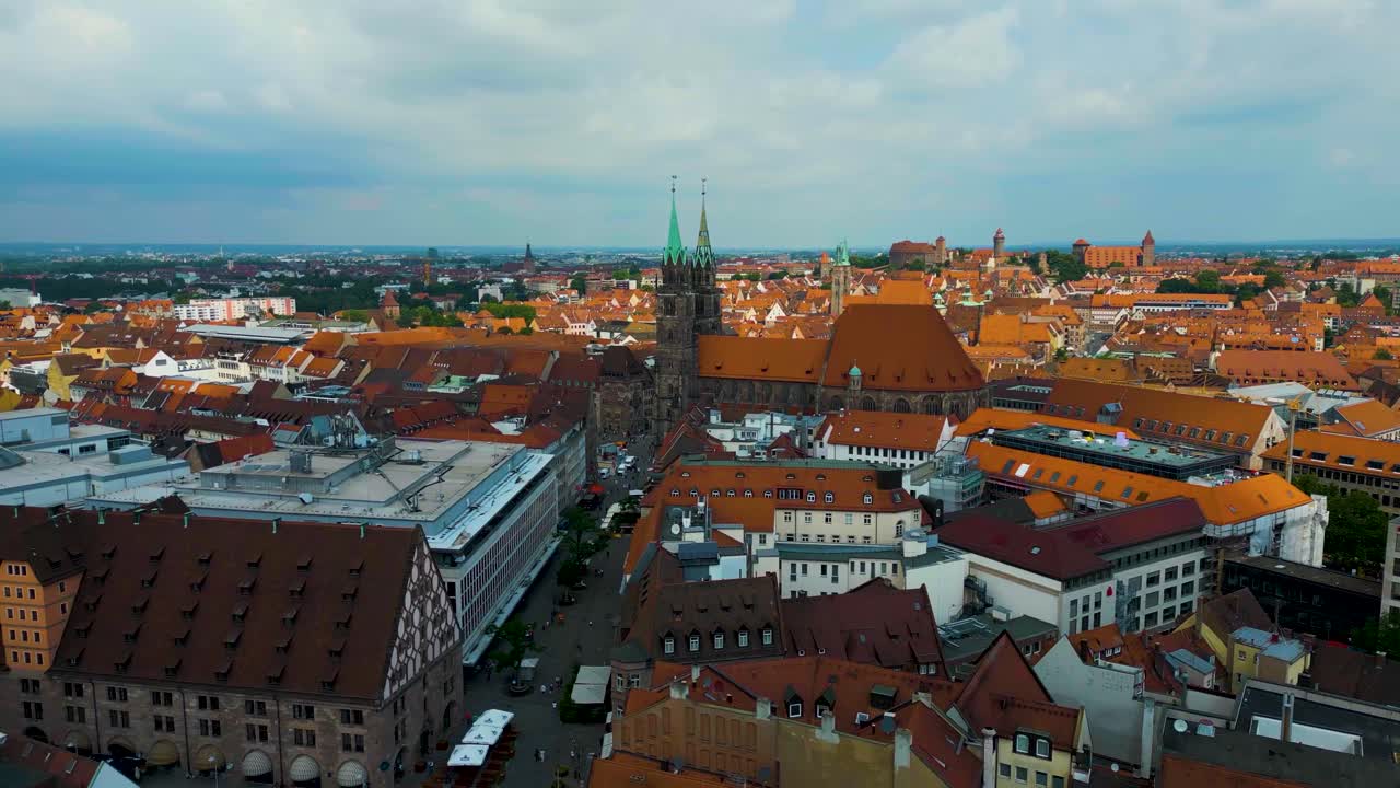 4K Aerial Drone Video of Copper-clad Spiers and Tiled Roof of St. Lawrence Church in Downtown Nurnberg, Germany