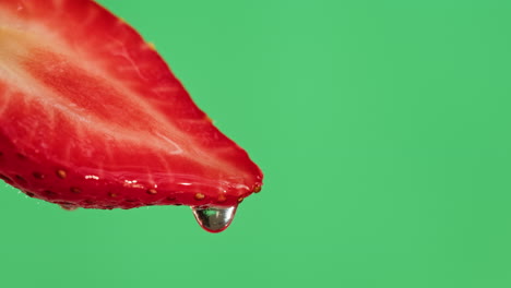 close-up of a sliced strawberry with water droplet