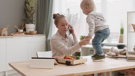 working mom babysitting toddler