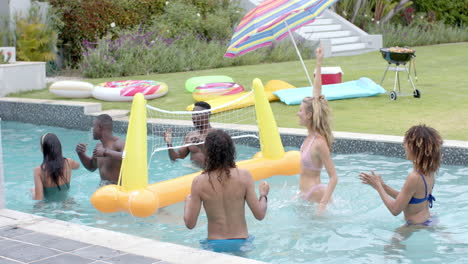 diverse group enjoys a pool game at a home outdoor setting