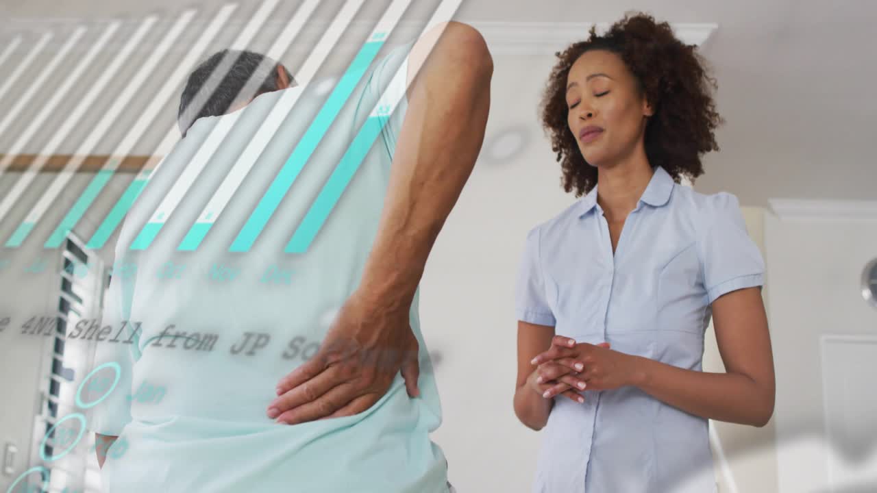 Senior man pressing back and adjusting posture as therapist guiding relief with scrolling data