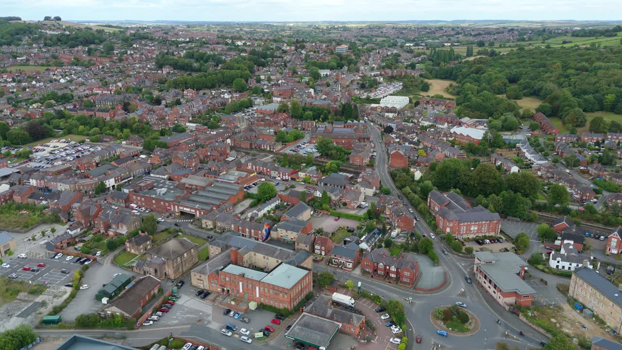 Aerial drone view of Belper town with scenic green landscape and rolling hills in Derbyshire Dales United Kingdom