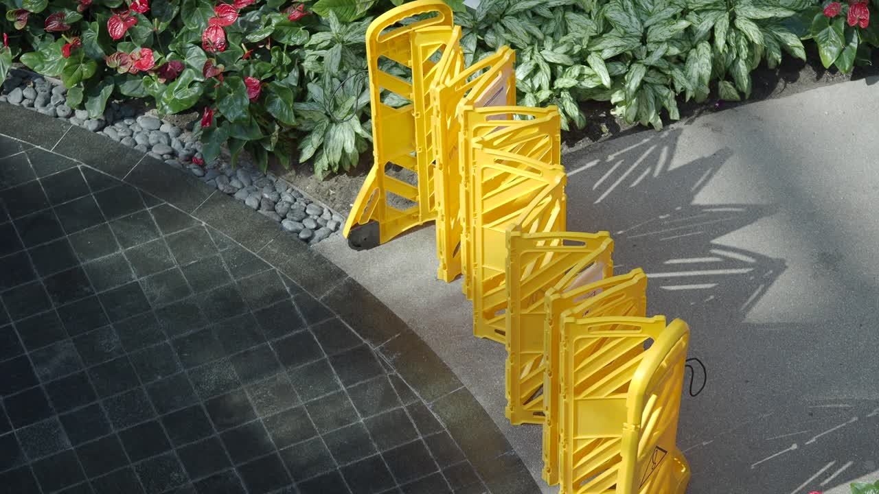 Yellow Plastic Barriers in a Garden Setting