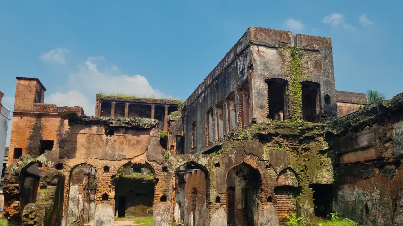 Panam Nagar, Bangladesh: a crumbling colonial mansion with sunlit bricks and weathered arches, revealing the charm and history of a bygone era