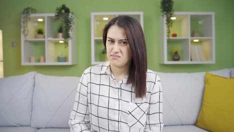 woman is disgusted, disgusted woman looking at camera.