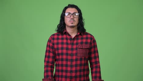 handsome hipster man smiling while wearing eyeglasses