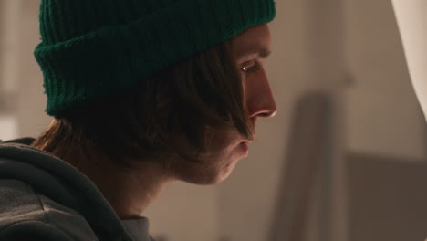 Young Man Working on a Surfboard