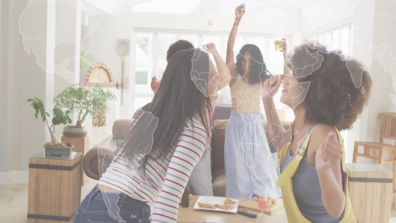 Four women starting dancing around coffee table for marketing ad while world map overlay fading in