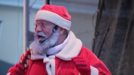 portrait of senior man dressed in santa costume gesturing welcome sign and singing songs holiday portrait of senior man dressed in santa costume gesturing welcome sign and singing songs holiday concept high quality footage