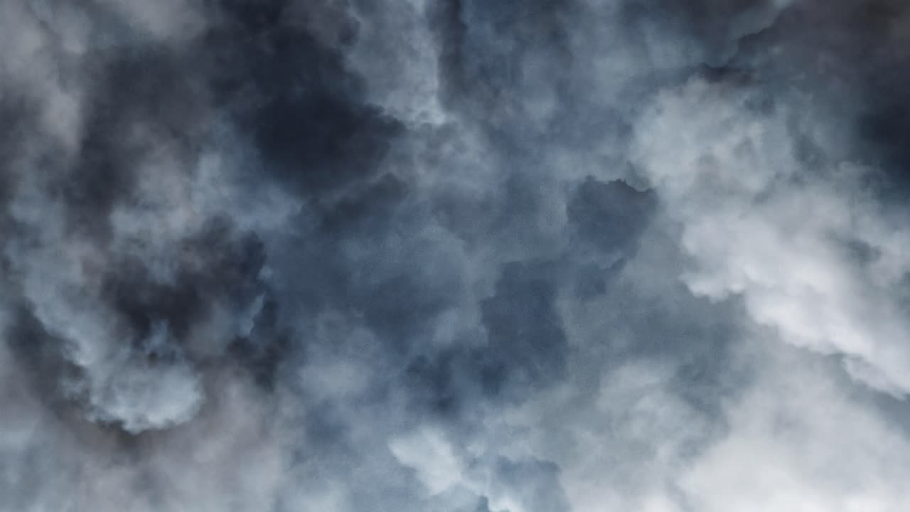 Incredibly thick cumulus clouds in the dark sky with lightning striking, thunderstorms