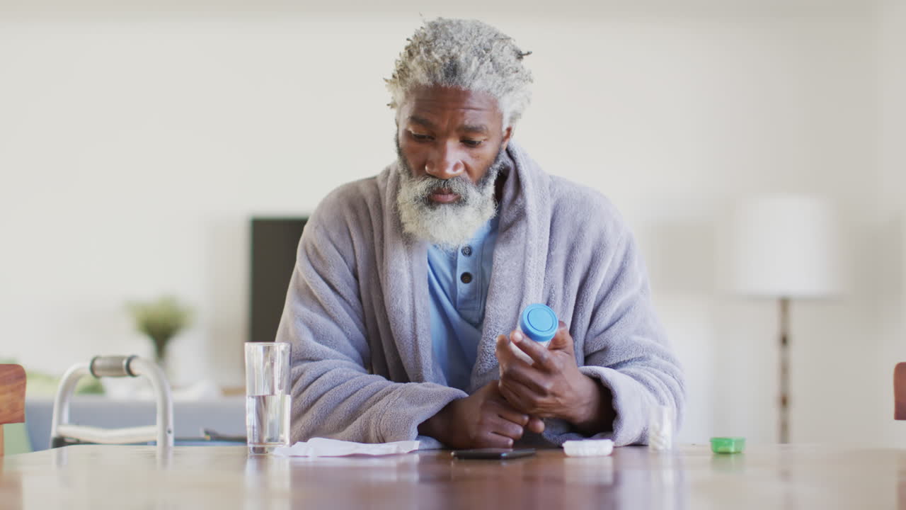 Senior man holding an empty medication container