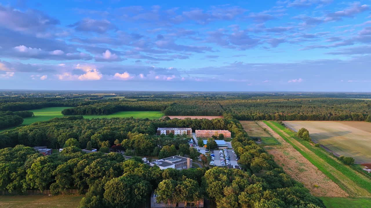 Aerial view of green landscape. Expansive greenery and fields captured from above, showcasing beautiful trees and a peaceful environment during daytime