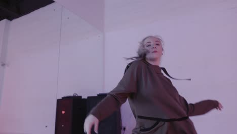 woman practicing hip hop dance in studio