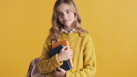 teenage caucasian girl student wearing backpack.