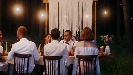 outdoor dinner party in the woods