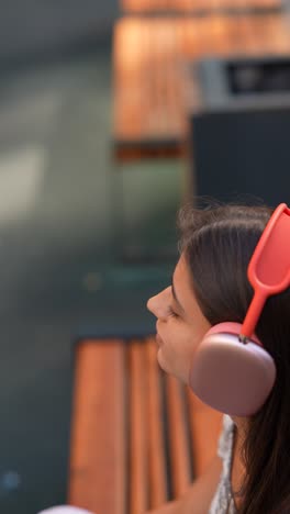 woman listening to music outdoors