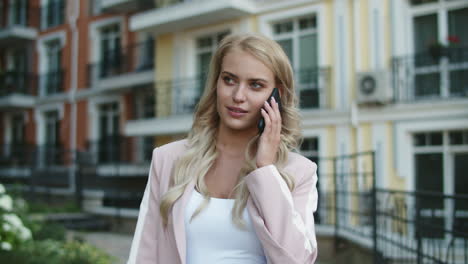 closeup businesswoman using phone at street. businesswoman talking smartphone