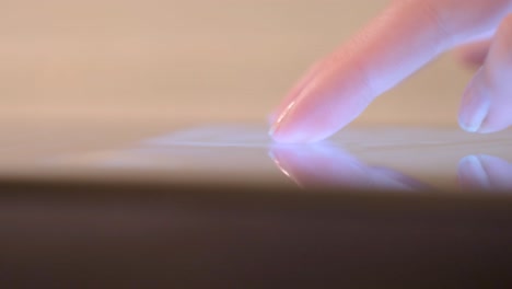 hand touching a tablet screen