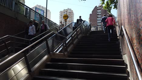 establisher of people going downstairs at buenos aires underground subway station of las heras argentina at daylight