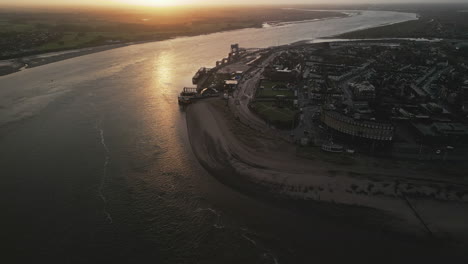 Slow-motion-dockland-approach-at-dawn-up-river-Wyre-at-fishing-port-Fleetwood