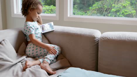 Baby-girl-using-digital-table-at-home-4k