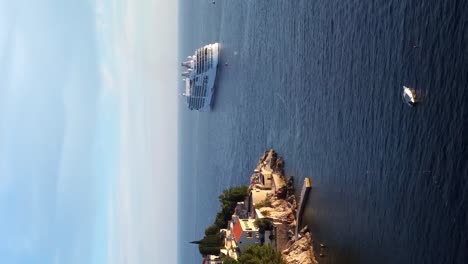 vertical drone shot of cruise ship in dubrovnik for holiday in europe