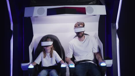 father and child enjoying a vr experience